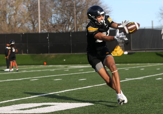 Iowa wide receiver Dayton Howard (20) reaches for the ball during practice Thursday, April 11, 2024 in Iowa City, Iowa.