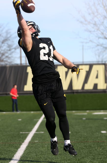 Iowa wide reciever Kaden Wetjen (21) attempts a leaping catch during practice Thursday, April 11, 2024 in Iowa City, Iowa.