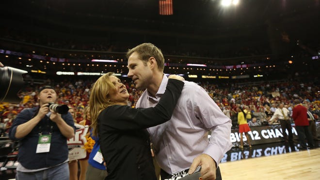 Iowa State head coach Fred Hoiberg gets a hug from his wife during the Big 12 Championship title game between Iowa State and Kansas on Saturday, March 14, 2015, outside the Sprint Center in Kansas City, Missouri.