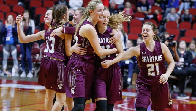 Members of the Grundy Center girls basketball team celebrate a win over Treynor in Class 2A on Friday, March 2, 2018, at Wells Fargo Arena in Des Moines.