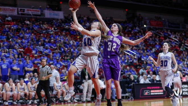 Newell-Fonda's Olivia Larsen runs up a shot as Kee High's Makayla Walleser reaches out for the attempted block during the 2018 Iowa Class 1A girls state basketball quarterfinal game on Tuesday, Feb. 28, 2018, at Wells Fargo Arena in Des Moines