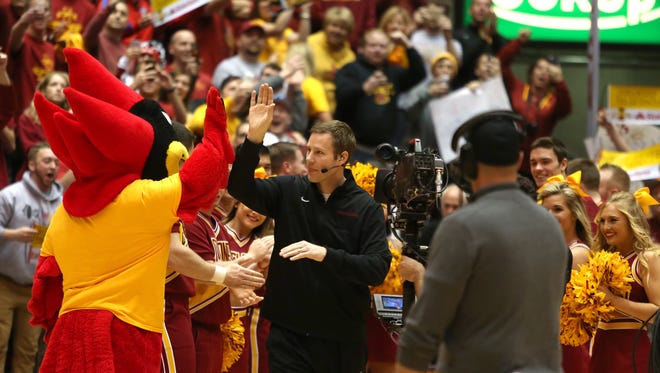 Coach Fred Hoiberg is greeted as he steps onto the court for his interview with ESPN during their broadcast of College Gameday on Jan. 17, 2015, at Hilton Coliseum in Ames.