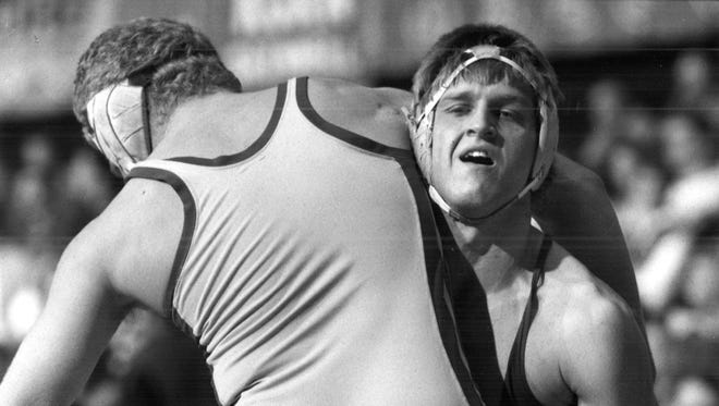 From 1987: Bart Chelesvig of Webster City (167 pounds) lifts North Scotts Wade Lamont at the state tournament.