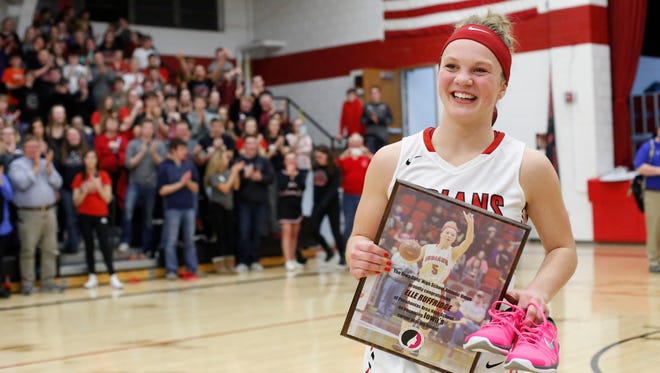 Elle Ruffridge smiles at the crowd Tuesday, Feb. 7, 2017 after she broke the state scoring record at Pocahontas Area High School in Pocahontas.
