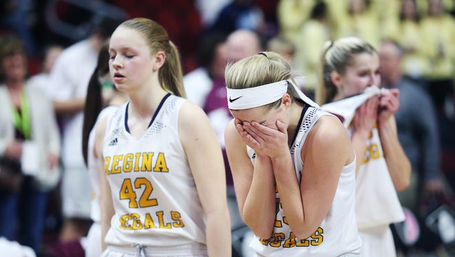 Iowa City Regina's Kennedy Wallace tears up after losing the Class 2A Girls' state basketball quarterfinal game between Iowa City Regina and Grundy Center on Tuesday, Feb. 27, 2018, in Wells Fargo Arena. Grundy Center won the game, 46-45.