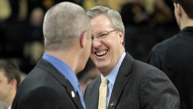 Iowa head coach Fran McCaffery jokes with Indiana State head coach, and former Iowa assistant coach, Greg Lansing prior to their first-round NIT game at Carver-Hawkeye Arena on Wednesday, March 20, 2013.