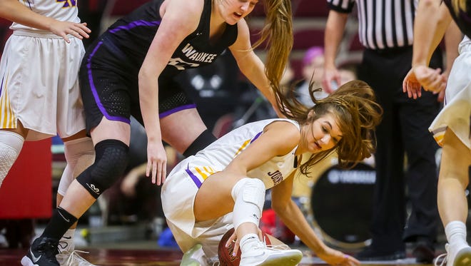 Johnston's (42)Regan Neshheim fights for aloose ball with Waukee's (52)Lexi Boles during their first round 5A matchup in the girls' state basketball tournament Monday, Feb. 26, 2018, at Wells Fargo Arena in Des Moines, Iowa.