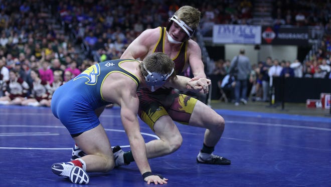 Wahlert's Kolton Bartow wrestles PCM's Lucas Roland during the championship round of the class 2A Iowa high school state wrestling tournament on Saturday, Feb. 17, 2018, in Wells Fargo Arena.