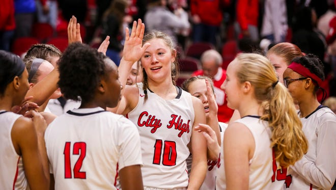 Iowa City High's (10) Ashley Joens congratulates teammates after beating Valley in their first round 5A matchup in the girls' state basketball tournament Monday, Feb. 26, 2018, at Wells Fargo Arena in Des Moines, Iowa. City High defeated Valley 78-62.