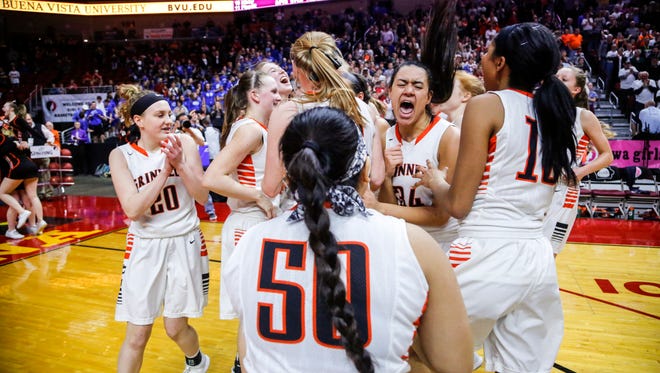 Grinnell players celebrate after winning the 4A semi-finals against Le Mars Thursday, March 1, 2018.