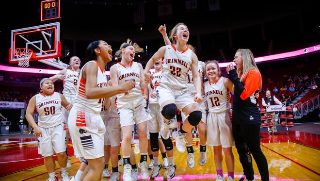 Grinnell players celebrate after winning the 4A semi-finals against Le Mars Thursday, March 1, 2018.