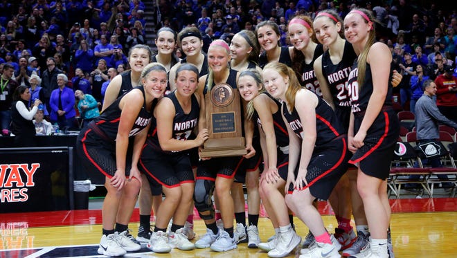 North Polk holds the semi-finalist trophy after the 3A semifinal against Crestwood Thursday, March 1, 2018.