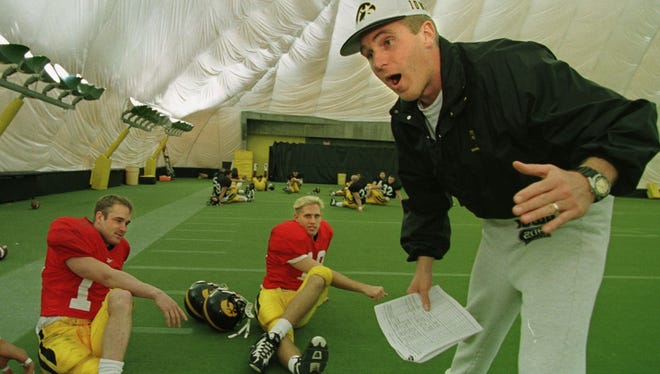 From 1998: Iowa quarterbacks Randy Reiners, left, and Scott Mullen took orders in 1998 from Hawkeye legend Chuck Long. The former Heisman Trophy runner-up switched to the offensive side of the ball as the quarterbacks coach after coaching defensive backs in 1997.