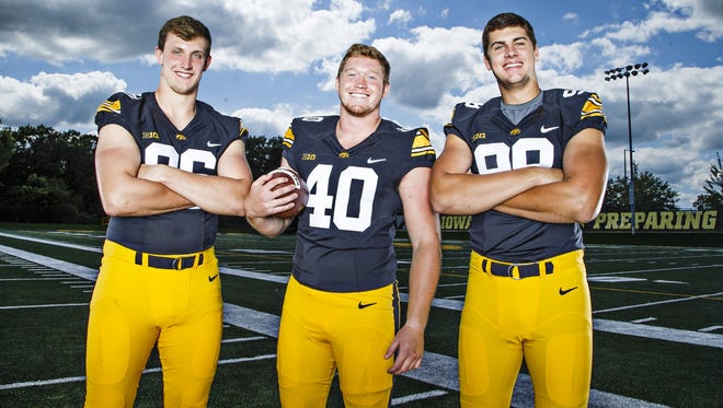 Parker Hesse, flanked by fellow Iowa defensive ends Matt Nelson (left) and Anthony Nelson, is ready to see how much pressure they can apply to opposing quarterbacks. They'll get their first chance next Saturday, against Miami of Ohio.