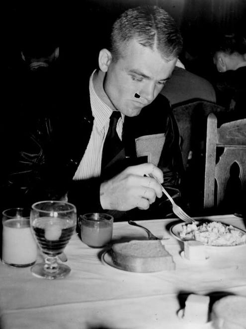 1939 - Nile Kinnick eats at the training table in the Memorial Union.