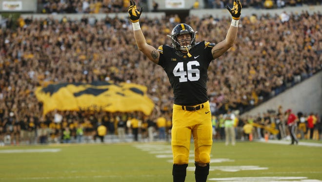 Iowa tight end George Kittle celebrates a touchdown against Iowa State last season. He may soon be celebrating an NFL contract after his performance in Saturday's scouting combine.