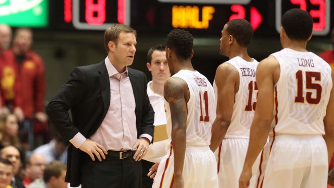 Iowa State's head coach Fred Hoiberg talks to his team on Jan. 26, 2014 at Hilton Coliseum in Ames
