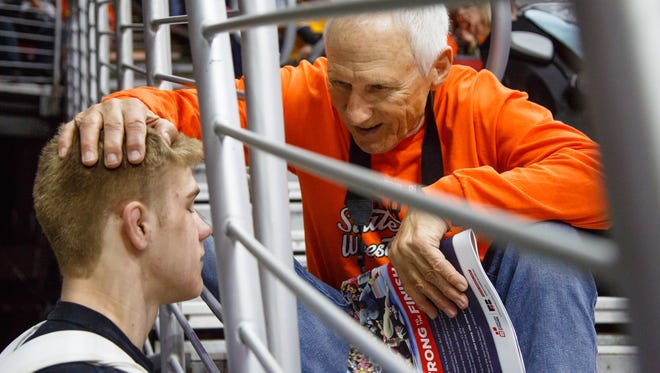 Easton Graff of Sargent Bluff gets some words of encouragement from his grandfather Ed Steck as he waits to wrestle in the  first round 2A state championships on Thursday, Feb. 15, 2018, in Des Moines.