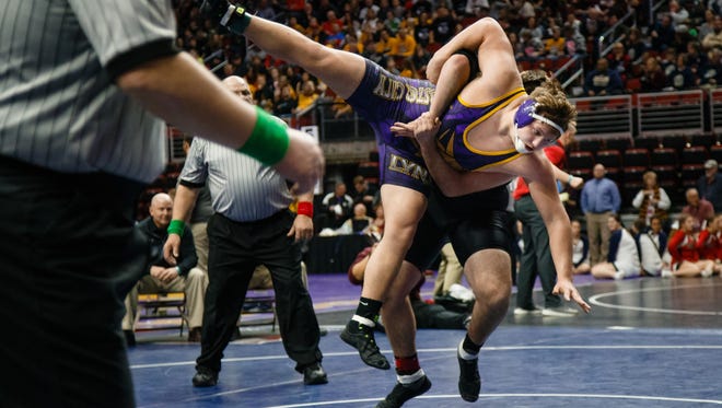 Cooper Lawson of Webster City, wrestles Mitchell Huisenga of Washington during their first round 2A 285lb match on Thursday, Feb. 15, 2018, in Des Moines. Lawson would go on to win 6-1.