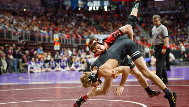 Brock Espalin of Des Moines East wrestles Cody Anderson of Waukee during their first round 3A state championship 120 lb match on Thursday, Feb. 15, 2018, in Des Moines. Espalin went on to win 5-2.