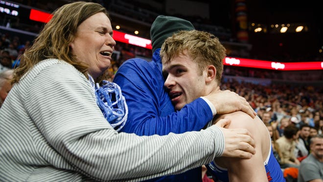 Zach Stewart of Perry celebrates a 3-1 victory over Deville Dentis of Des Moines East with his parents after his class 3A 138 pound championship match at Wells Fargo Arena on Saturday, Feb. 17, 2018, in Des Moines.