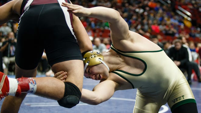 Greg Hagan of Dowling Catholic wrestles Francis Duggan of Iowa City West during their class 3A 220 pound championship match at Wells Fargo Arena on Saturday, Feb. 17, 2018, in Des Moines. Duggan would go on to win 13-4.