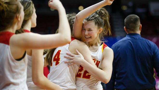 Marion's Sophie Willette (22) is greeted at the bench in the closing minute of their their 4A girls state basketball championship game against Grinnell at Wells Fargo Arena on Friday, March 2, 2018, in Des Moines. Marion would go on to win 69-48.