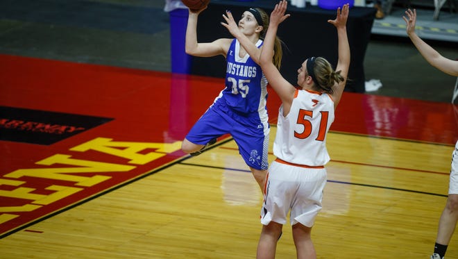 Newell-Fonda's Megan Morenz (34) shoots around Springville's Mikayla Nachazel (51) during the first half of their 1A girls state basketball championship game at Wells Fargo Arena on Saturday, March 3, 2018, in Des Moines. Springville takes a 25-20 lead into halftime.