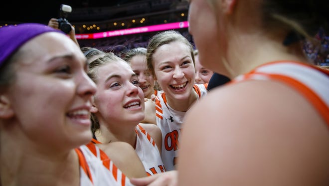 Springville celebrates its 60-49 victory over Newell-Fonda winning the 1A girls state basketball championship game at Wells Fargo Arena on Saturday, March 3, 2018, in Des Moines.