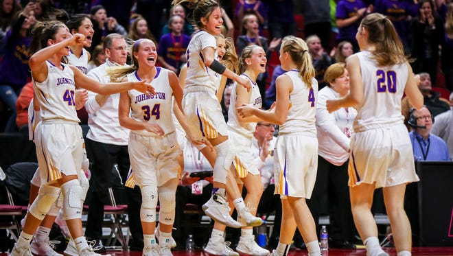 Johnston celebrate their win over Waukee in their first round 5A matchup in the girls' state basketball tournament Monday, Feb. 26, 2018, at Wells Fargo Arena in Des Moines, Iowa. Johnston defeated Waukee 73-48.