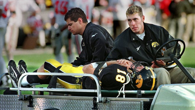 From 1998: Iowa quarterback Scott Mullen is carted off the field after his collarbone was broken during the first half of Iowa's loss to Ohio State.