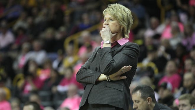 Iowa head coach Lisa Bluder watches her team during their game against Wisconsin at Carver-Hawkeye Arena on Thursday, Feb. 26, 2015.