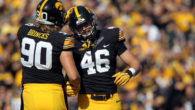 Iowa's Sam Brincks congratulates tight end George Kittle after his touchdown during the Hawkeyes' game against Illinois at Kinnick Stadium on Saturday, Oct. 10, 2015.
