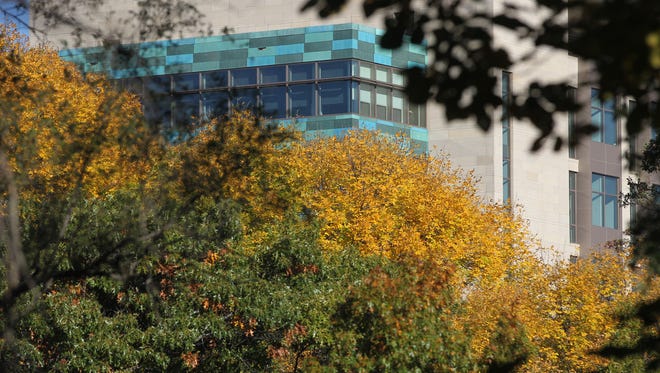 Leaves begin to change colors near the John and Mary Pappajohn Biomedical Discovery Building on Wednesday, Oct. 14, 2015.