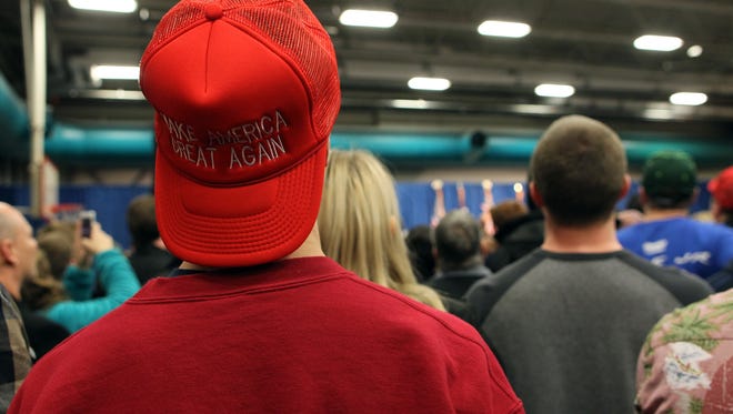 A supporter waits for Republican presidential candidate Donald Trump at the University of Iowa Field House in Iowa City on Tuesday, Jan. 26, 2016.