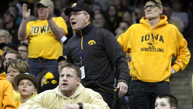 Former Iowa head coach Dan Gable reacts as Thomas Gilman wrestles Penn State's Nico Megaludis in the 125 pound semifinals at the Big Ten Championships at Carver-Hawkeye Arena on Saturday, March 5, 2016.