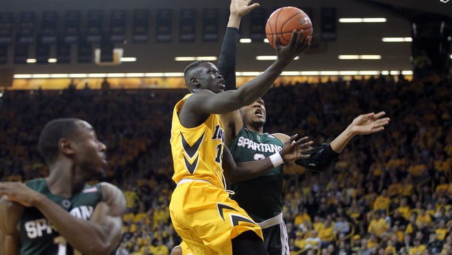 Iowa's Peter Jok goes up for a shot during the Hawkeyes' game against Michigan State at Carver-Hawkeye Arena on Tuesday, Dec. 29, 2015.