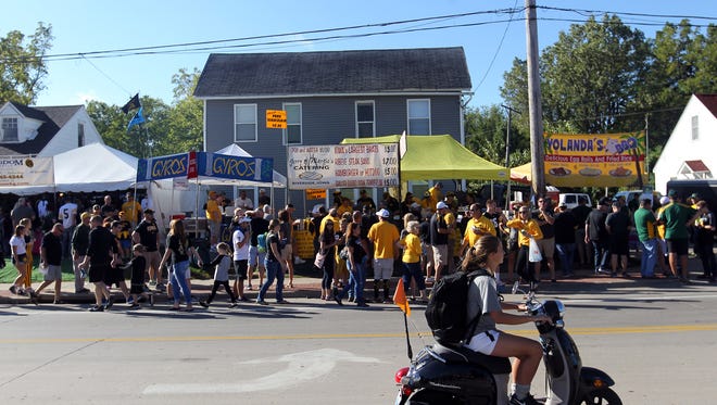 Football fans line up for food on Melrose Avenue prior to the Hawkeyes' game against North Dakota State at Kinnick Stadium on Saturday, Sept. 17, 2016.