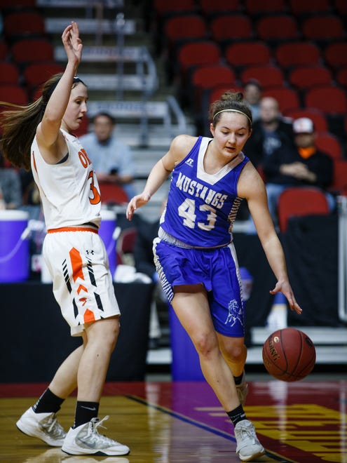 Newell-Fonda's Ella Larsen (43) tries to stay in bounds during the second half of their 1A girls state basketball championship game at Wells Fargo Arena on Saturday, March 3, 2018, in Des Moines. Springville would go on to win 60-49.