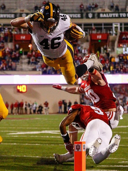 George Kittle leaps into the end zone against Indiana on Saturday, Nov. 7, 2015, in Bloomington, Ind.