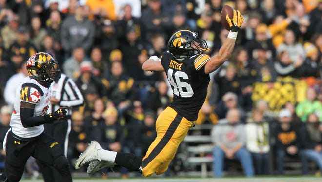 Iowa's George Kittle pulls in a deep pass during the Hawkeyes' game against Maryland at Kinnick Stadium on Saturday, Oct. 31, 2015.
