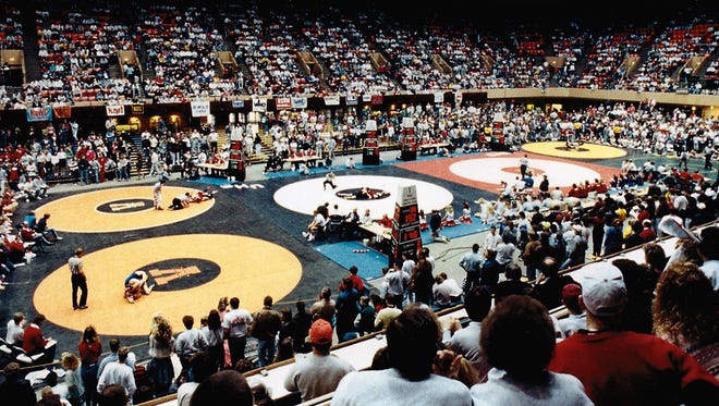 From 2001: Full stands and busy mats during the state tournament at Veterans Memorial Auditorium.