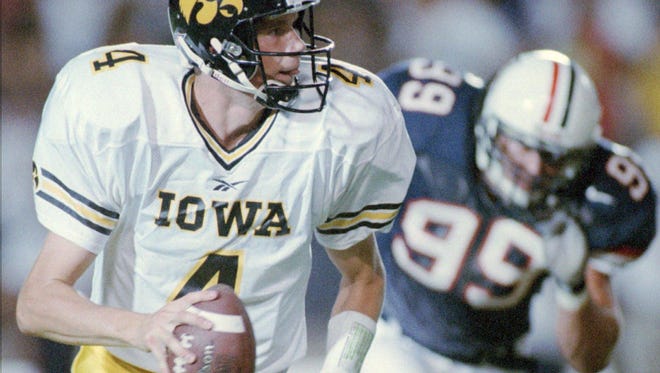 From 1998: Iowa quarterback Kyle McCann looks for a receiver during the Hawkeyes' loss loss at Arizona.