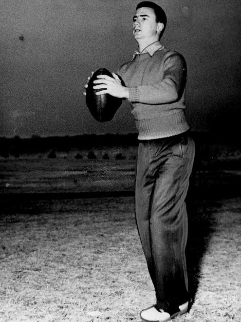 Ben Kinnick plays catch with a football. The brother of Iowa's Nile Kinnick was considered too small to play college football and played intramurals at Iowa State college.