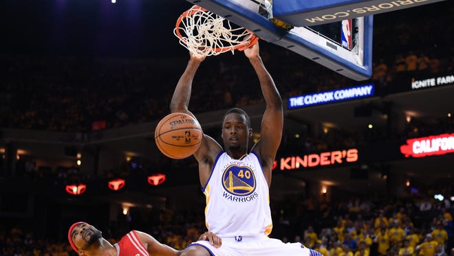 Golden State Warriors forward Harrison Barnes (40) dunks the basketball against Houston Rockets guard Corey Brewer (33) during game one of the Western Conference Finals of the NBA Playoffs on May 19 in Oakland, Calif.