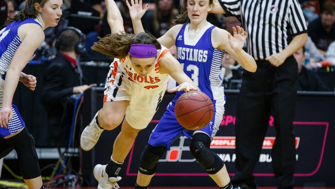 Springville's Rylee Menster (20) is tripped up during the second half of their 1A girls state basketball championship game at Wells Fargo Arena on Saturday, March 3, 2018, in Des Moines. Springville would go on to win 60-49.