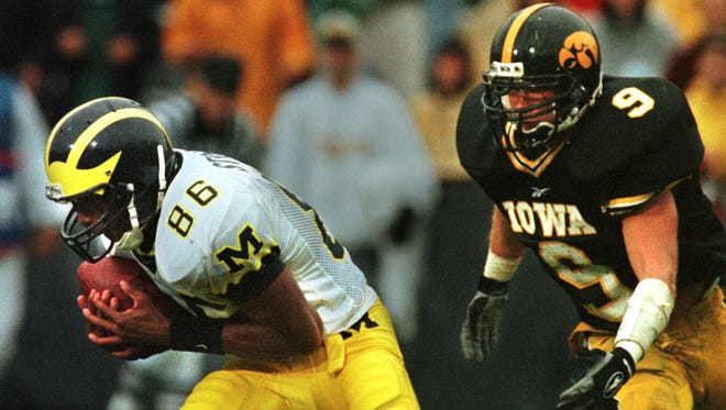 From 1998: Michigan's Tai Streets catches a touchdown pass in front of Iowa defensive back Matt Bowen.