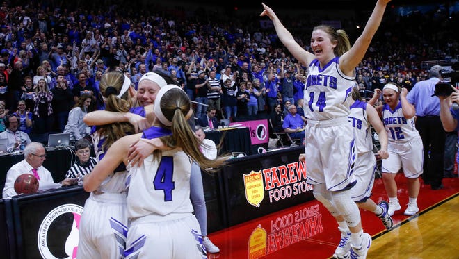 Members of the Crestwood girls basketball celebrate after beating Sioux Center on Saturday, March 3, 2018, to win the Iowa Class 3A trophy during the Iowa high school girls basketball state championship game at Wells Fargo Arena in Des Moines.