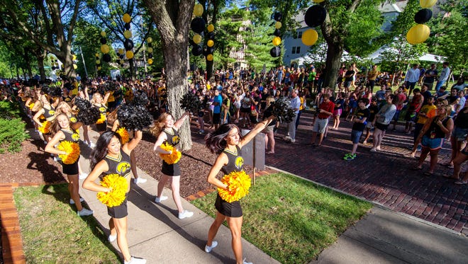 Members of the UI Dance Team entertain incoming freshman during the On Iowa! convocation and block party at the President's residence on Sunday, August 24, 2014.