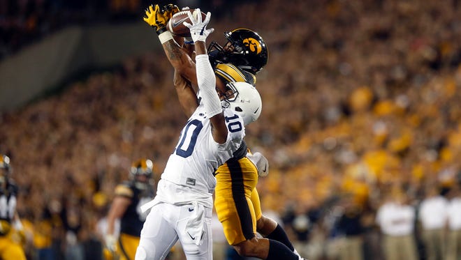 Iowa's Amani Hooker breaks up a pass intended for Penn State's Brandon Polk during their game at Kinnick Stadium on Saturday, Sept. 23, 2017.
